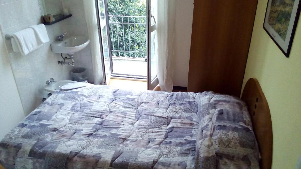 Postel nebo postele na pokoji v ubytování Hotel Tirreno
