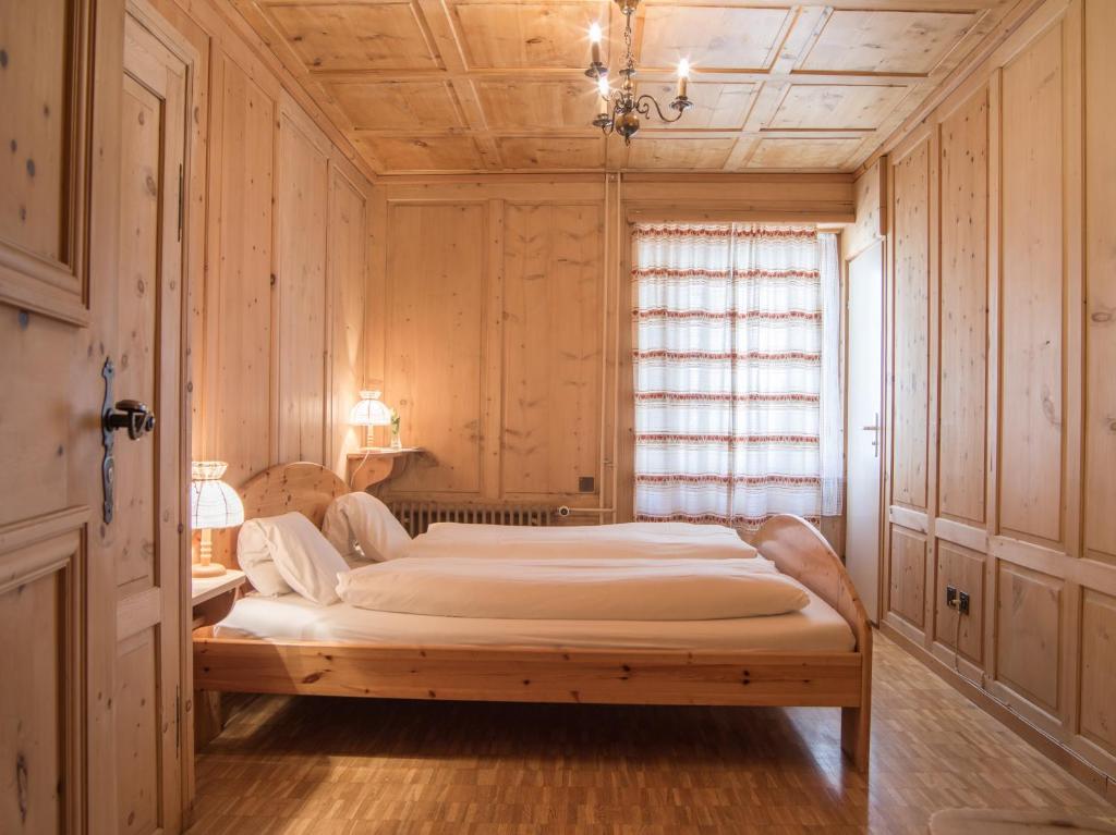 Postel nebo postele na pokoji v ubytování Hotel Alpina