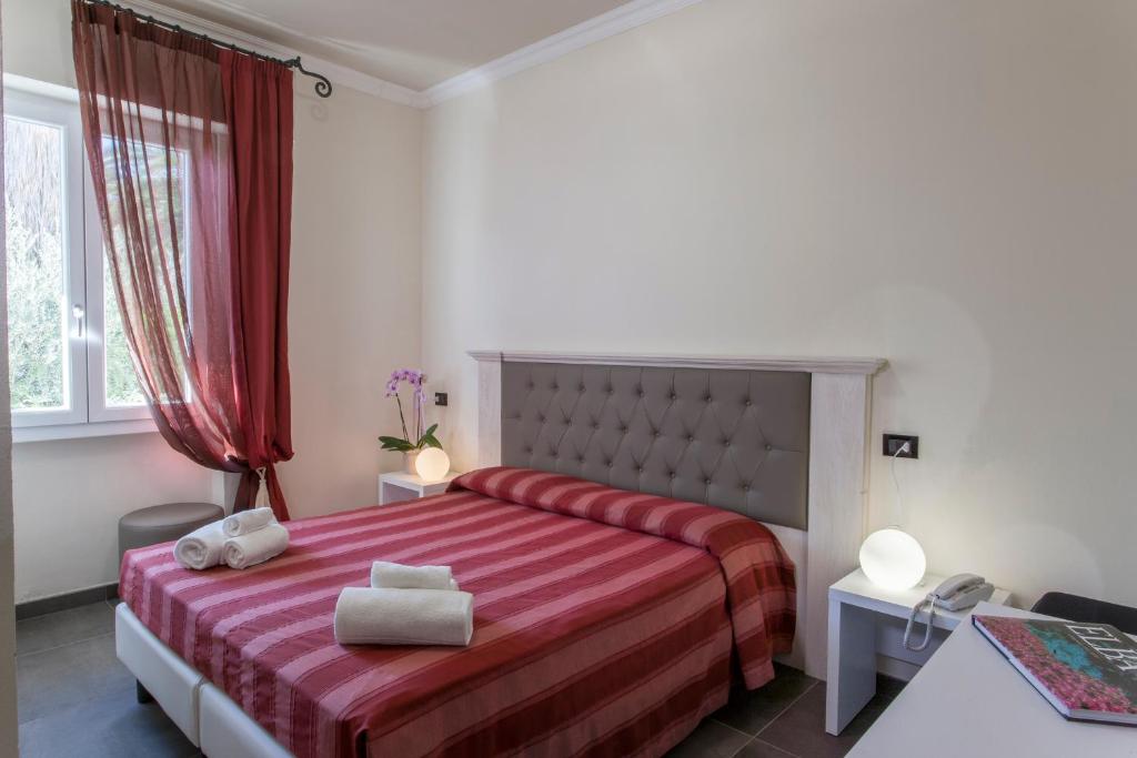 Postel nebo postele na pokoji v ubytování Hotel Barracuda