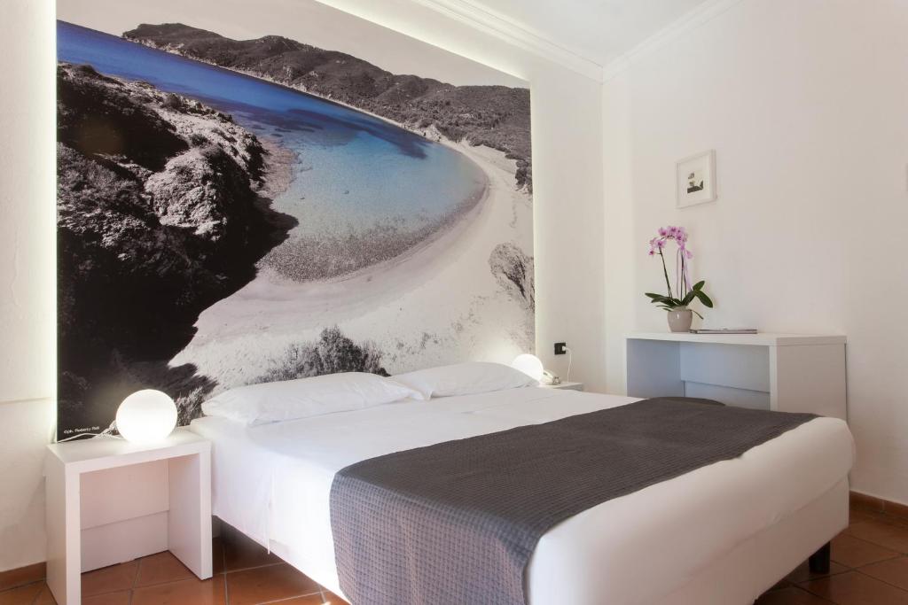 Postel nebo postele na pokoji v ubytování Hotel Barracuda