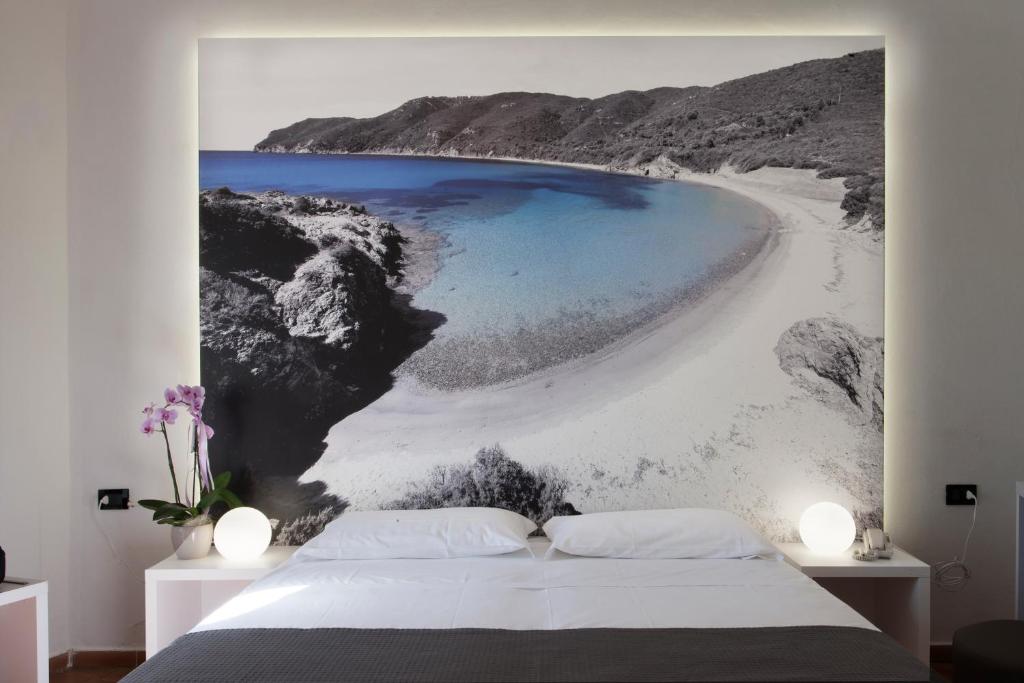 Postel nebo postele na pokoji v ubytování Hotel Barracuda