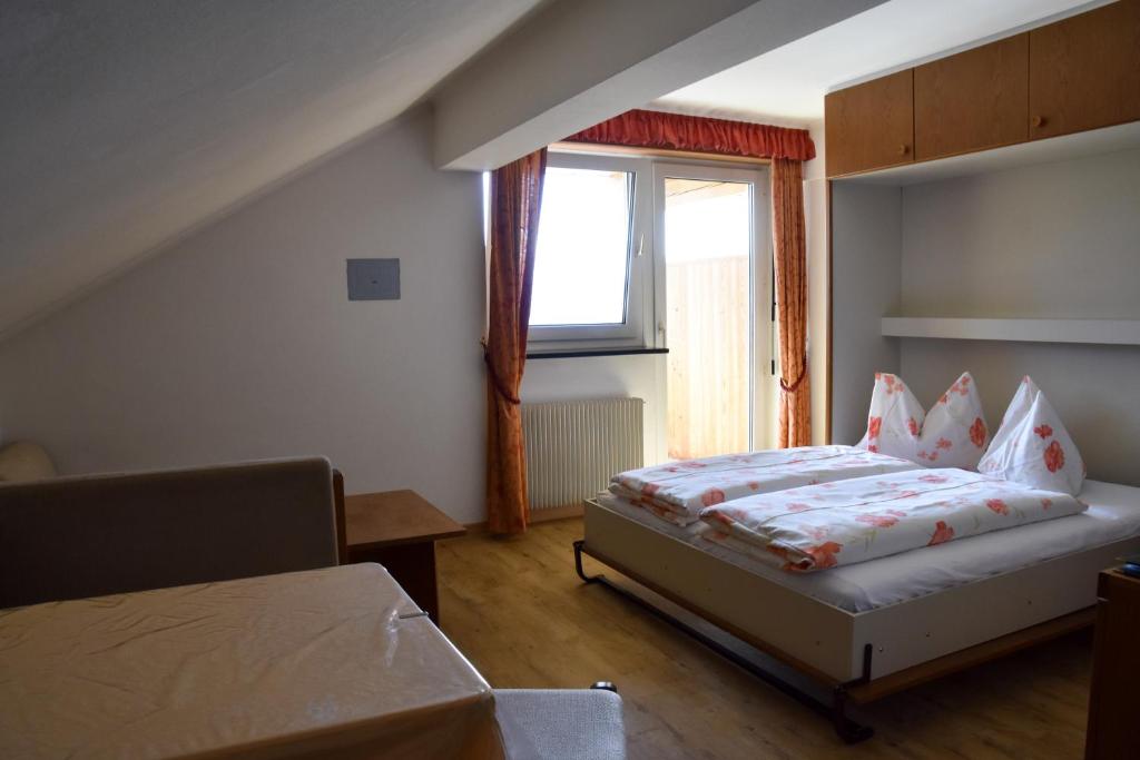 Postel nebo postele na pokoji v ubytování Residence Terentis