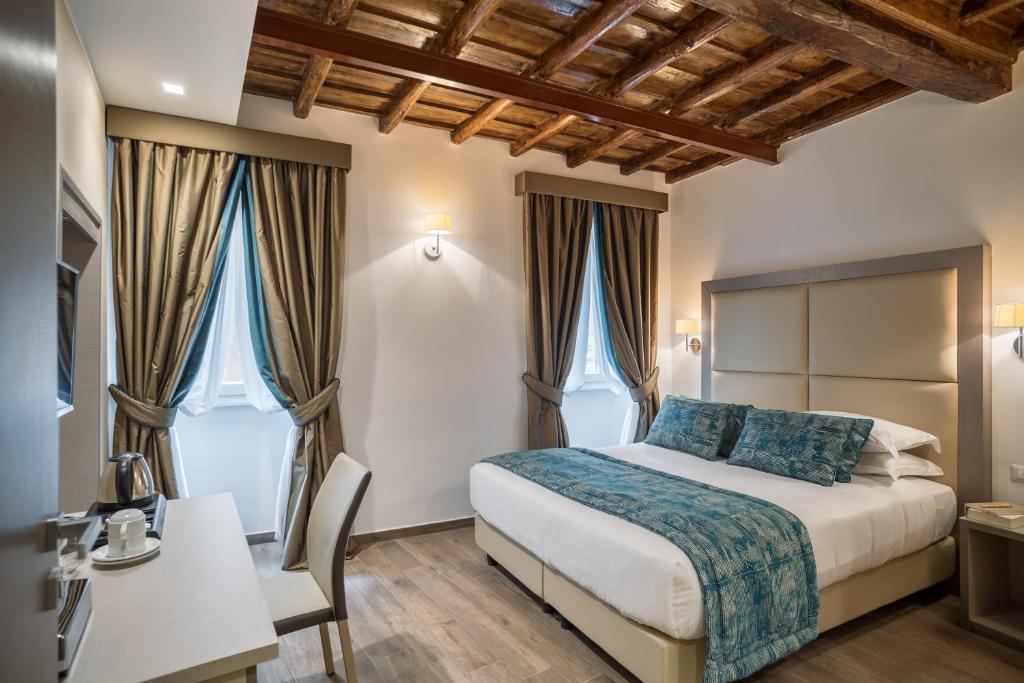 A bed or beds in a room at Reginella Suites