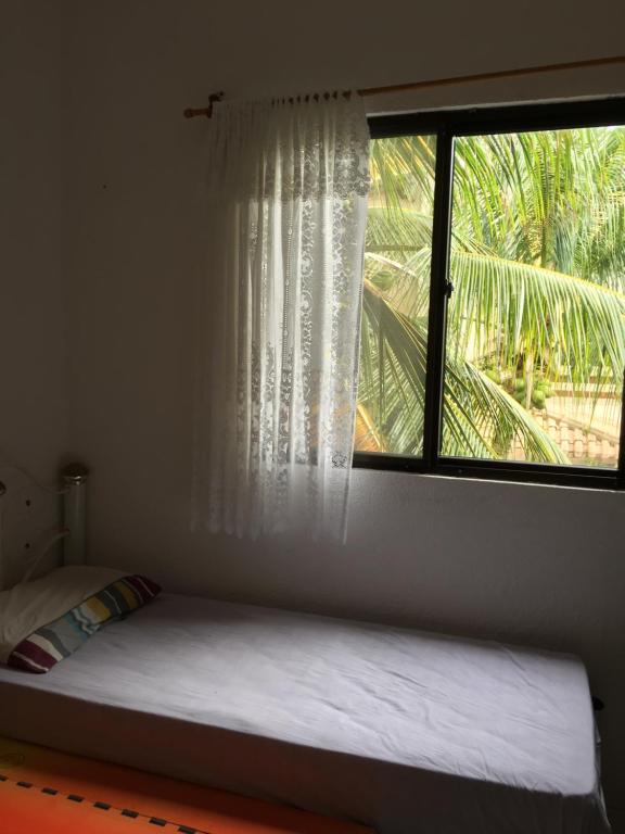 A bed or beds in a room at Linda casa na Praia do Flamengo