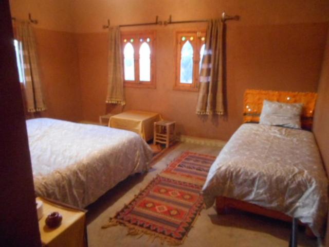 Letto o letti in una camera di Hotel Carrefour des Nomades