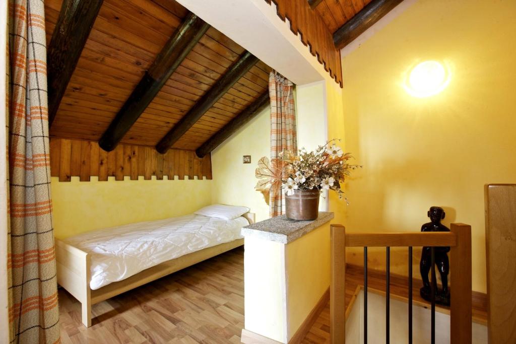 Letto o letti in una camera di Rustico La Vigna
