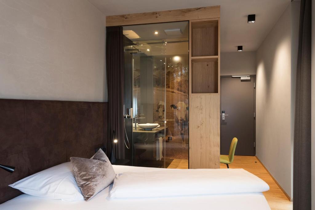 Postel nebo postele na pokoji v ubytování Ellgass Allgäu Hotel