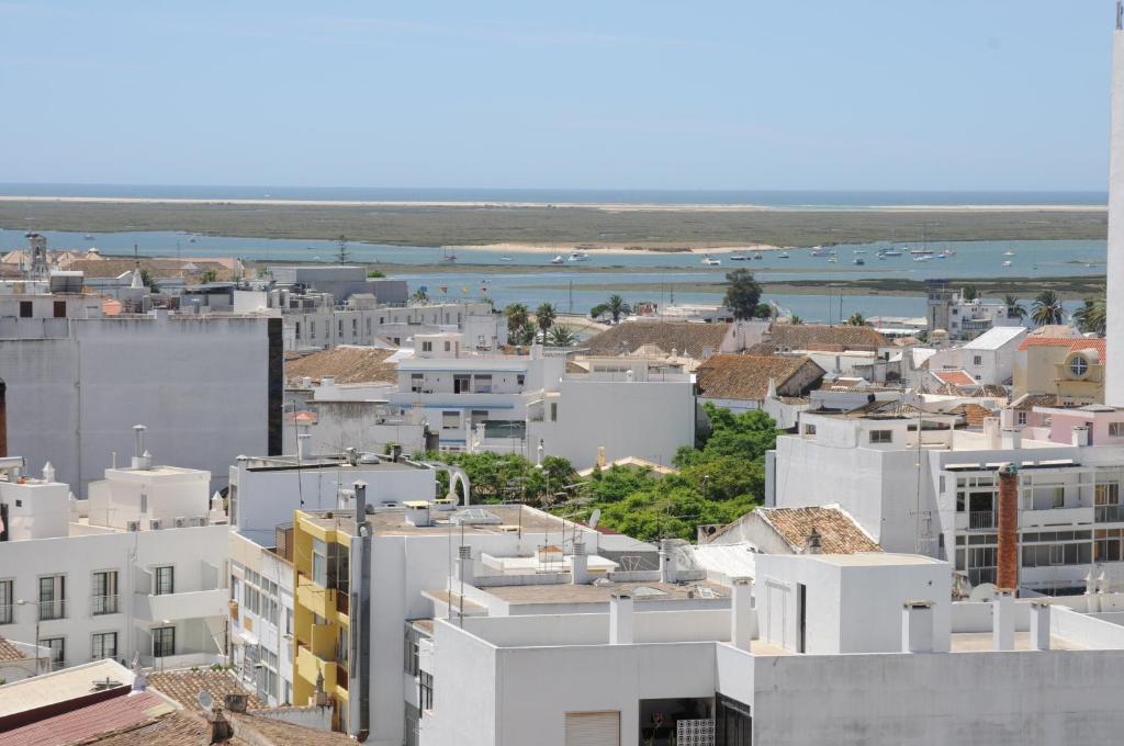 an aerial view of a city with buildings at Best Western Hotel Dom Bernardo in Faro
