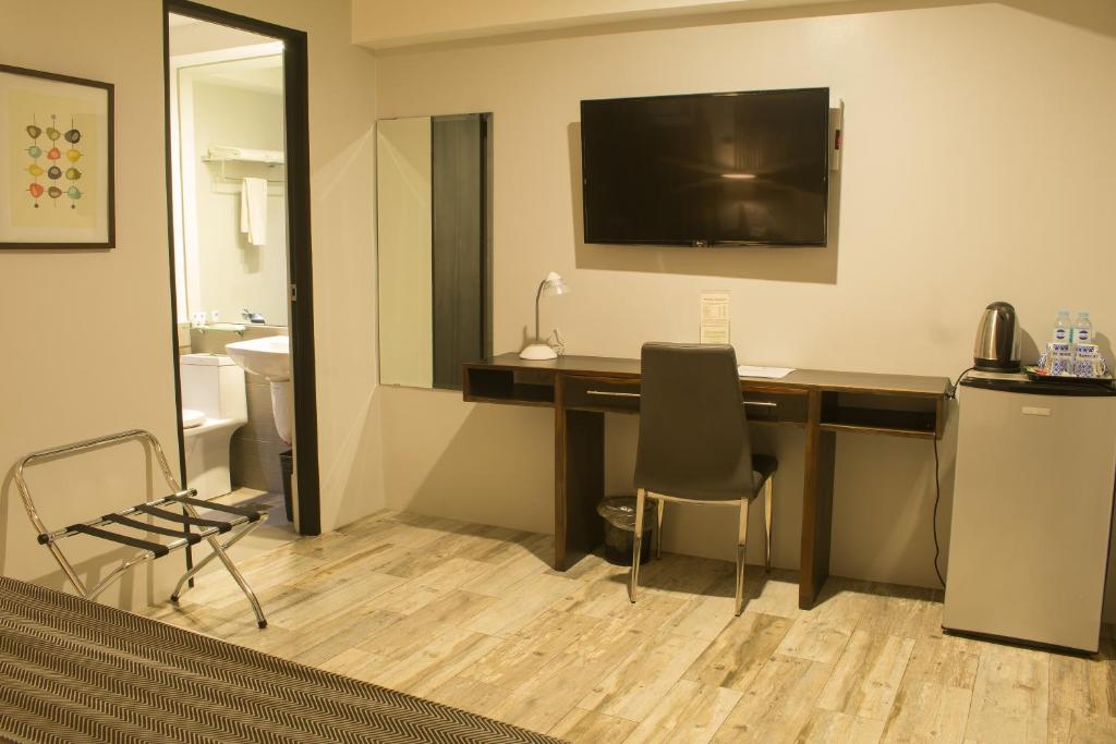 TV a/nebo společenská místnost v ubytování 1A Express Hotel