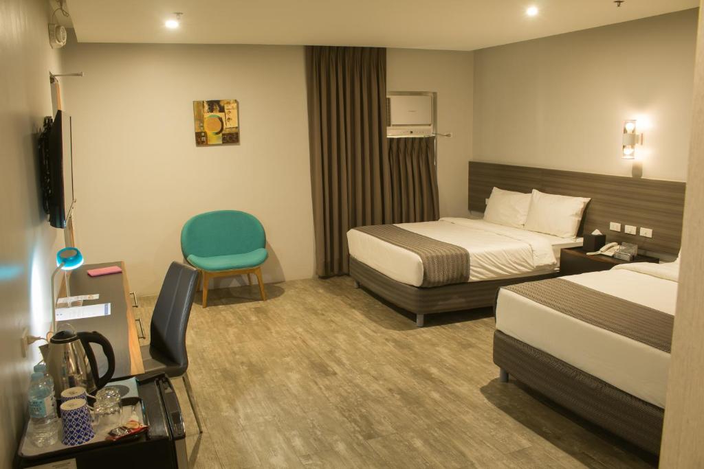 Postel nebo postele na pokoji v ubytování 1A Express Hotel