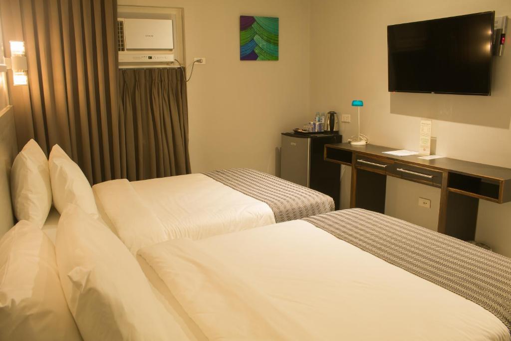 Postel nebo postele na pokoji v ubytování 1A Express Hotel