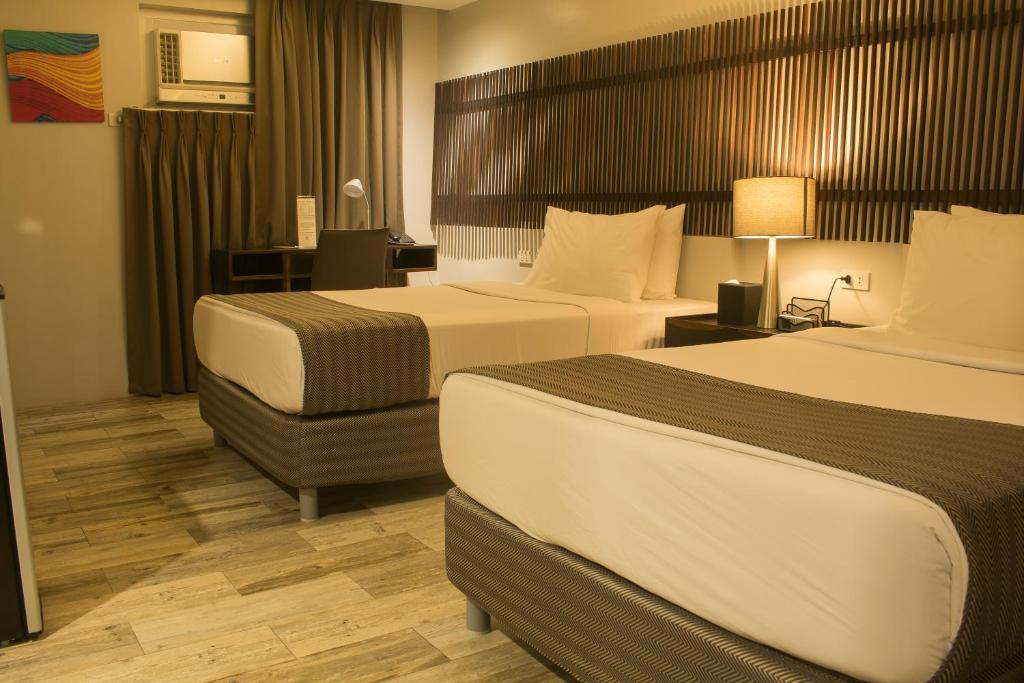 Postel nebo postele na pokoji v ubytování 1A Express Hotel