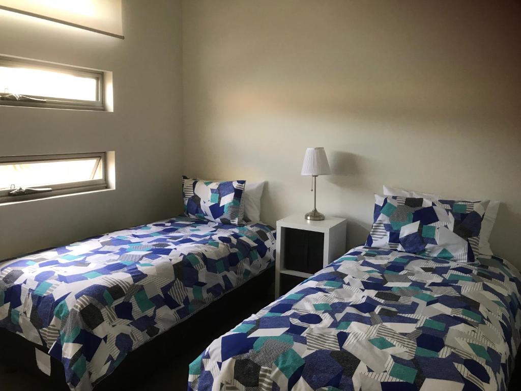 Postel nebo postele na pokoji v ubytování Penneshaw Oceanview Apartments