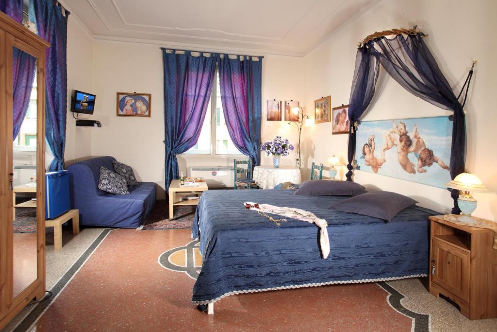 a bedroom with a blue bed and purple curtains at B&B DolceVirginia in Rome