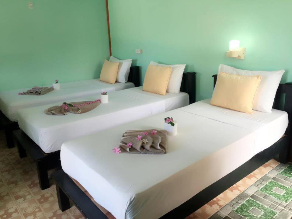 מיטה או מיטות בחדר ב-Golden Guesthouse