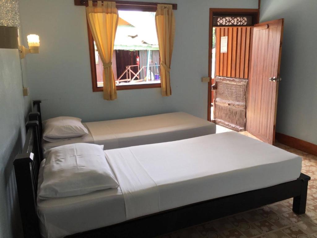 Postel nebo postele na pokoji v ubytování Golden Hill Guesthouse