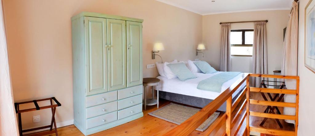 Postel nebo postele na pokoji v ubytování Vine Guesthouse
