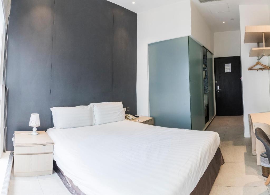 Postel nebo postele na pokoji v ubytování Wifi Boutique Hotel