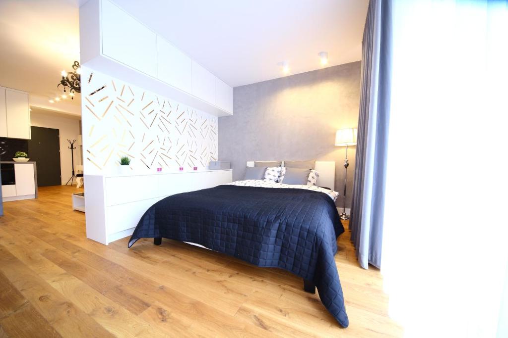 Postel nebo postele na pokoji v ubytování Kazimierz Friendhouse Apartments