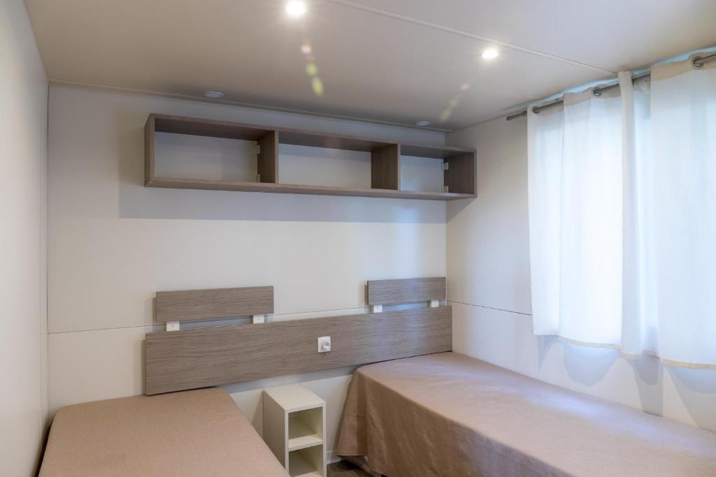 Postel nebo postele na pokoji v ubytování Giannella Camping
