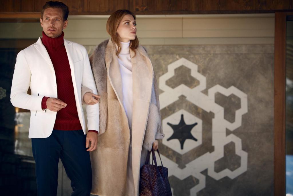 a man and a woman standing next to each other at Apogée Courchevel, Oetker Hotels in Courchevel