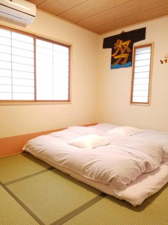 Postel nebo postele na pokoji v ubytování Villa M Guesthouse
