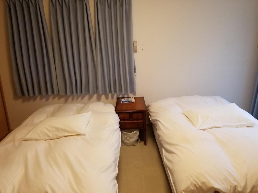 Postel nebo postele na pokoji v ubytování Villa M Guesthouse