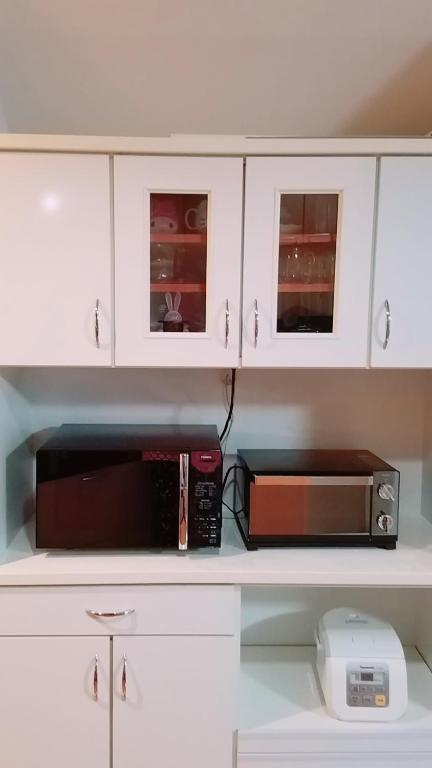 Kuchyň nebo kuchyňský kout v ubytování Villa M Guesthouse