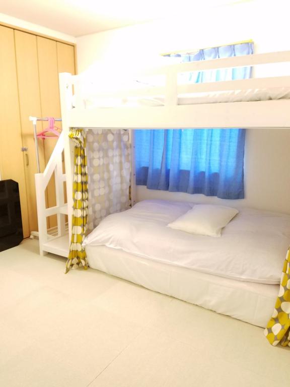 Postel nebo postele na pokoji v ubytování Villa M Guesthouse