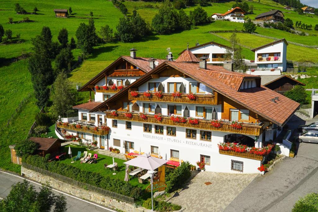 an aerial view of a large building with flowers at Naturhotel Miraval in Perca