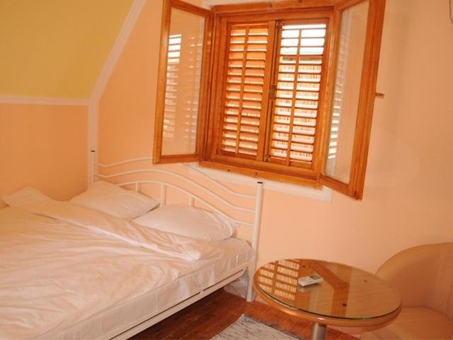 Postel nebo postele na pokoji v ubytování B&B Queen