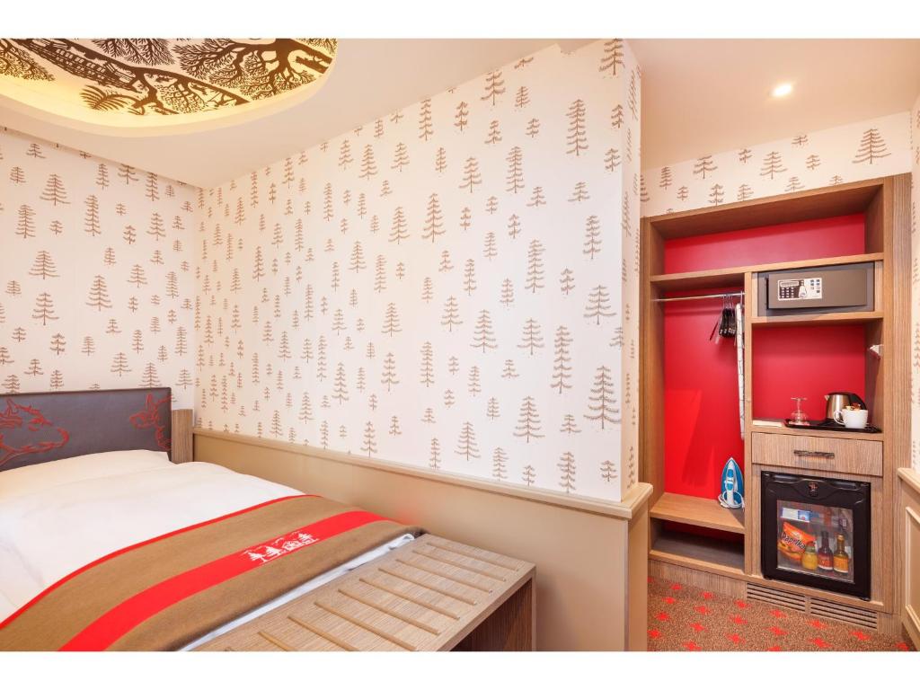 A bed or beds in a room at Swiss Night by Fassbind