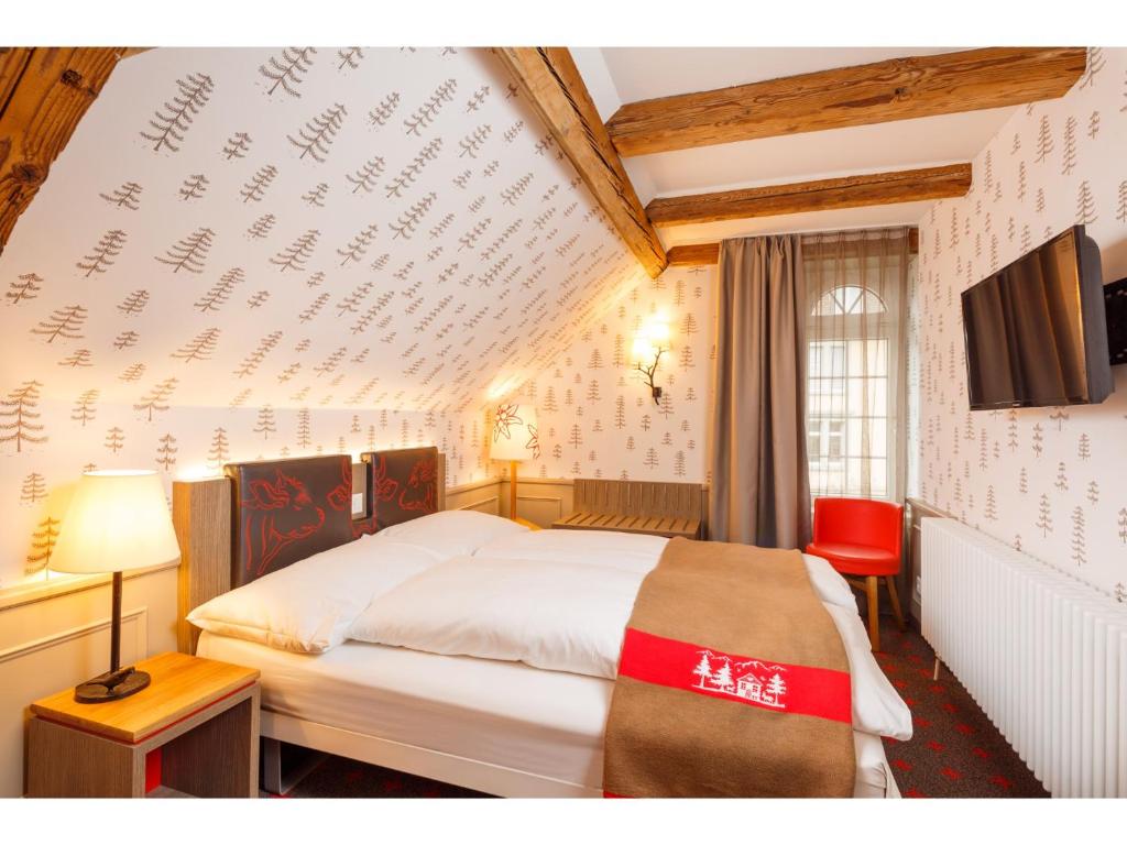 A television and/or entertainment centre at Swiss Night by Fassbind