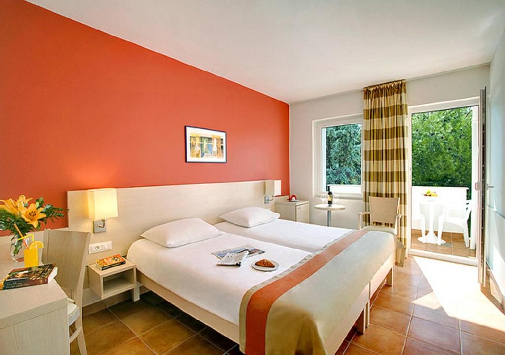 Postel nebo postele na pokoji v ubytování Valamar Tamaris Resort