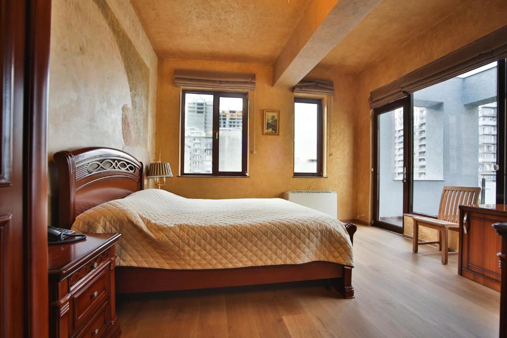 Postel nebo postele na pokoji v ubytování Hotel Wine Palace
