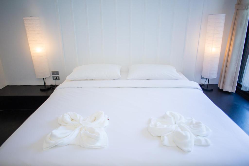 Postel nebo postele na pokoji v ubytování Trat 101 Hotel - SHA Certified