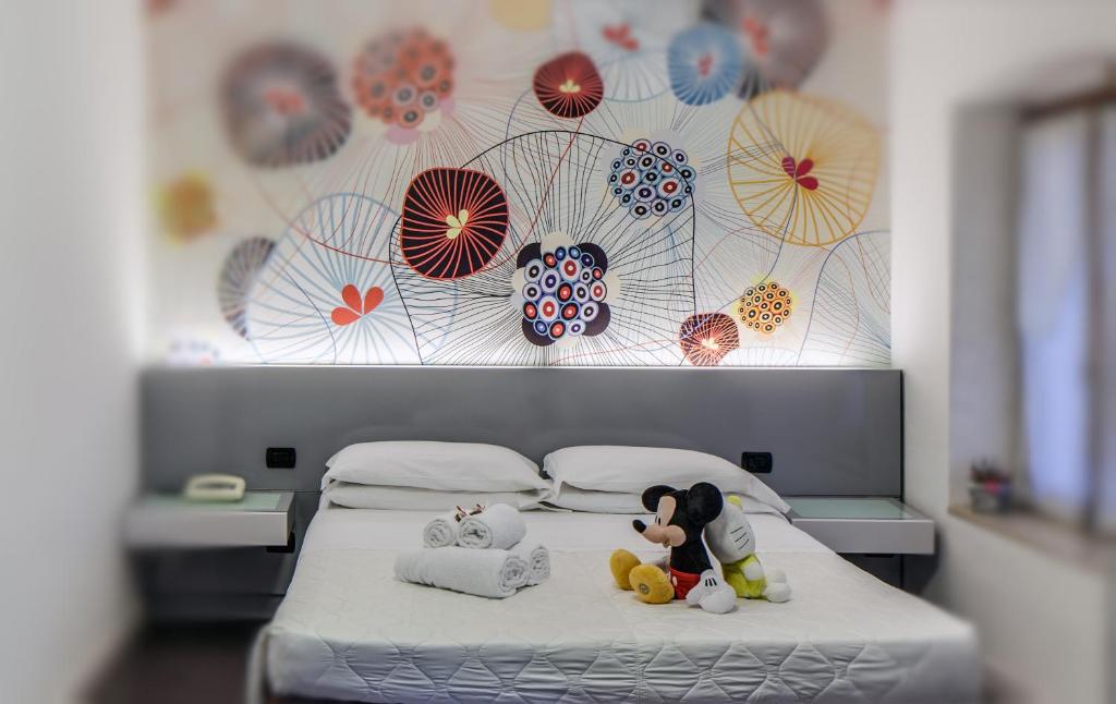 Postel nebo postele na pokoji v ubytování Hotel Gattopardo