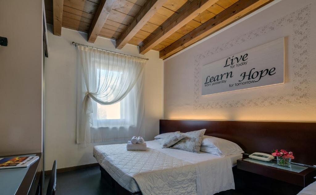 Postel nebo postele na pokoji v ubytování Hotel Gattopardo