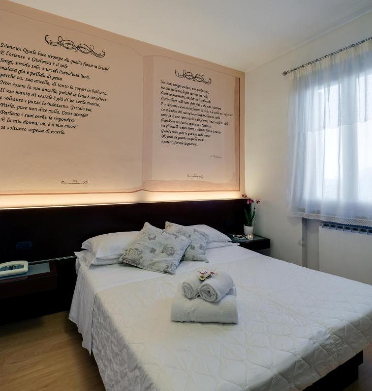 Postel nebo postele na pokoji v ubytování Hotel Gattopardo
