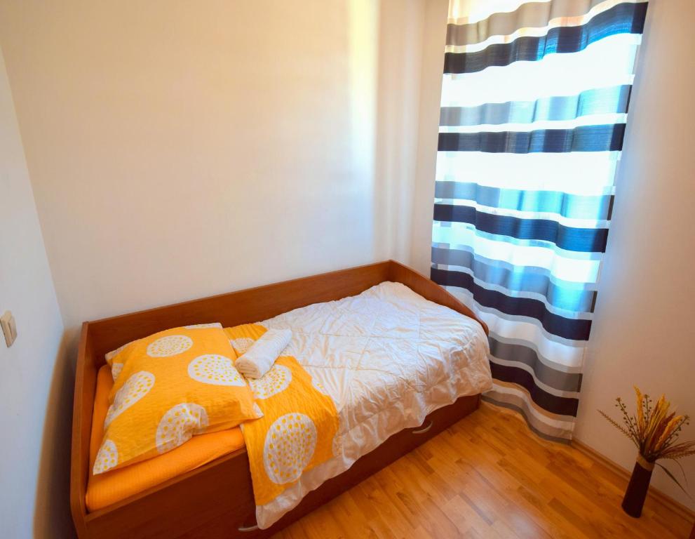 Postel nebo postele na pokoji v ubytování Apartments Ivanka