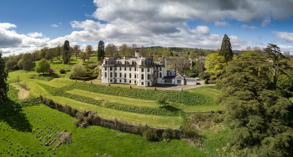 an aerial view of a large house in a field at Gartmore House Bed & Breakfast in Aberfoyle