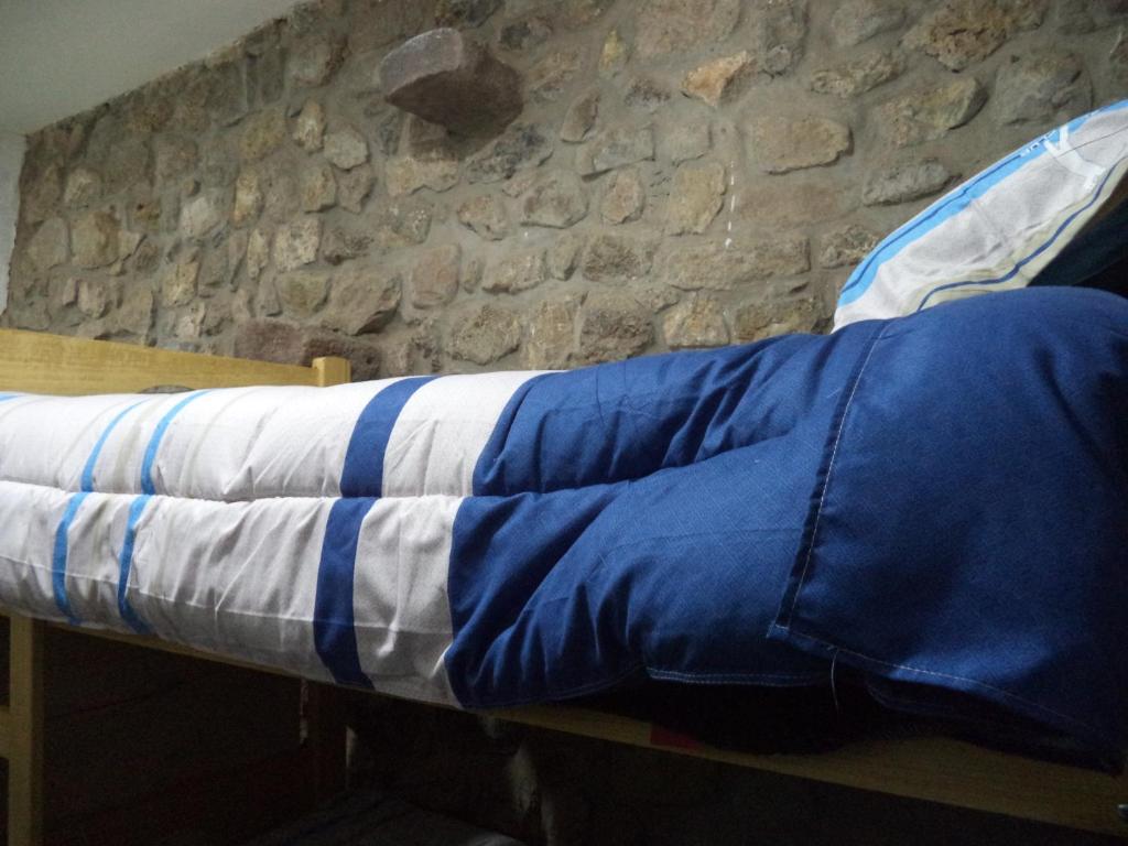 Uma cama ou camas num quarto em Gringo's Wasi