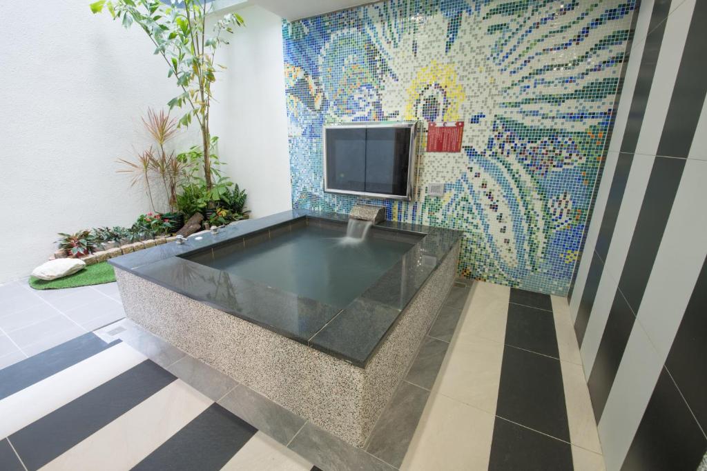 TV a/nebo společenská místnost v ubytování Ting-Shuai Motel