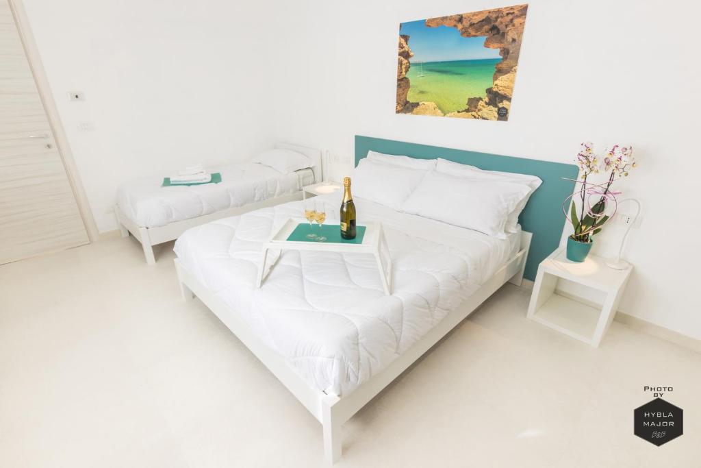 Postel nebo postele na pokoji v ubytování Hybla Major B&B