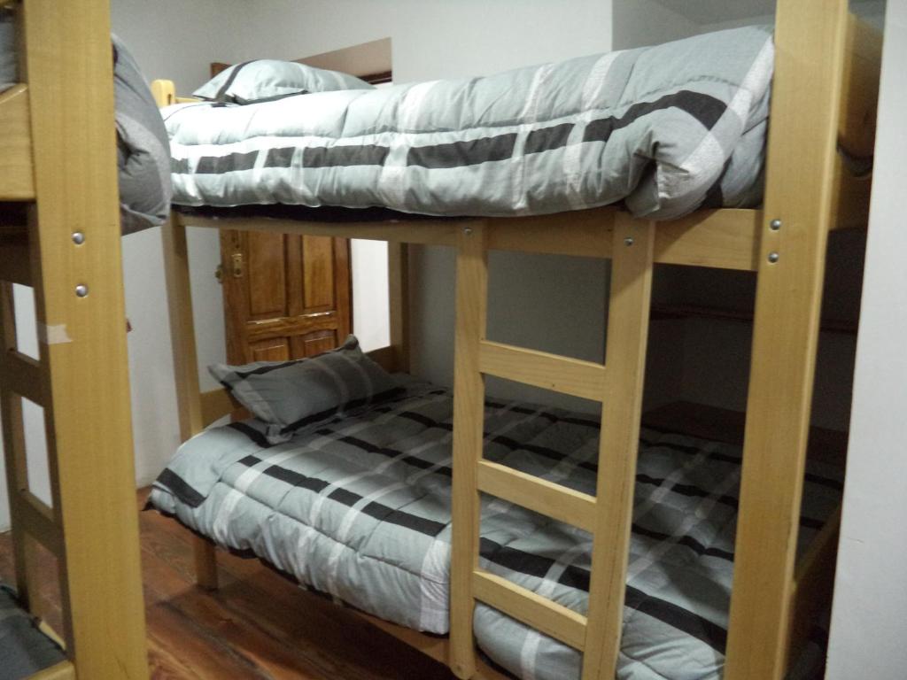 Uma cama ou camas num quarto em Gringo's Wasi