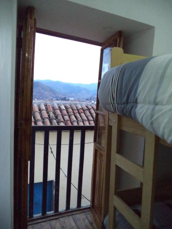 Uma cama ou camas num quarto em Gringo's Wasi