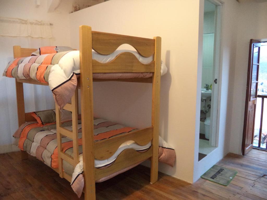 Uma cama ou camas num quarto em Gringo's Wasi