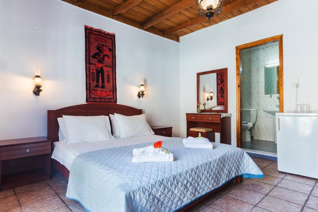 Postel nebo postele na pokoji v ubytování Daskalogiannis Hotel