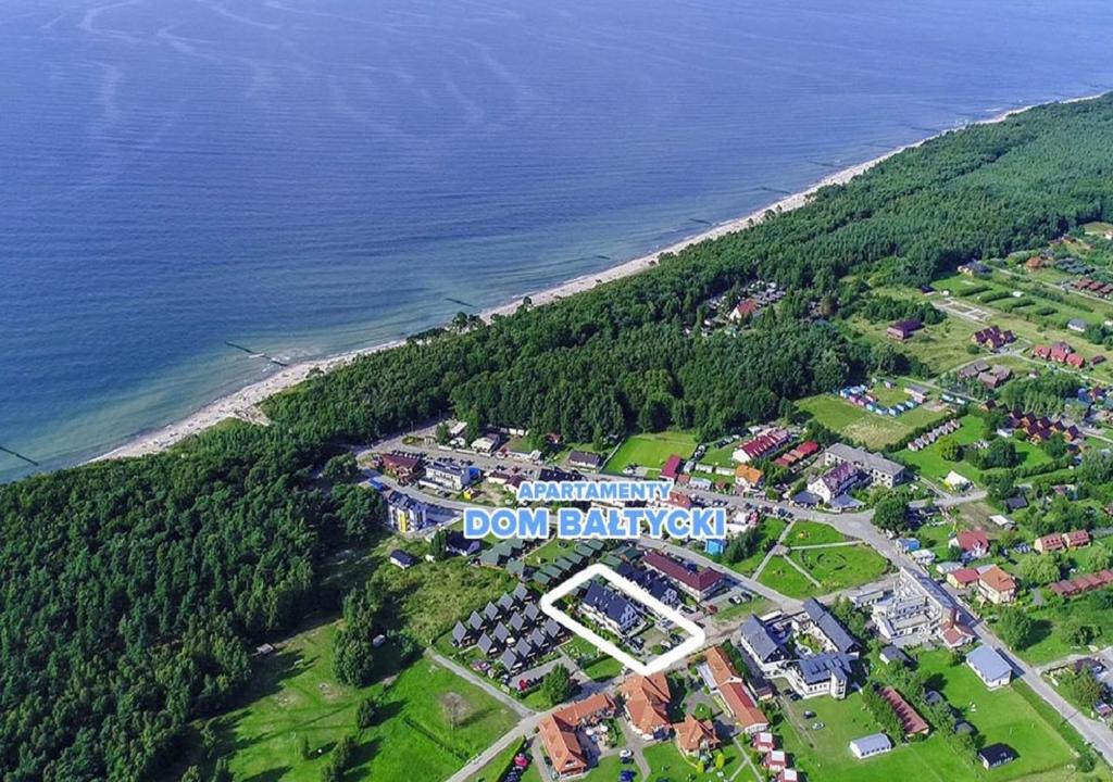 an aerial view of a town next to the ocean at Apartamenty Dom Bałtycki in Wicie