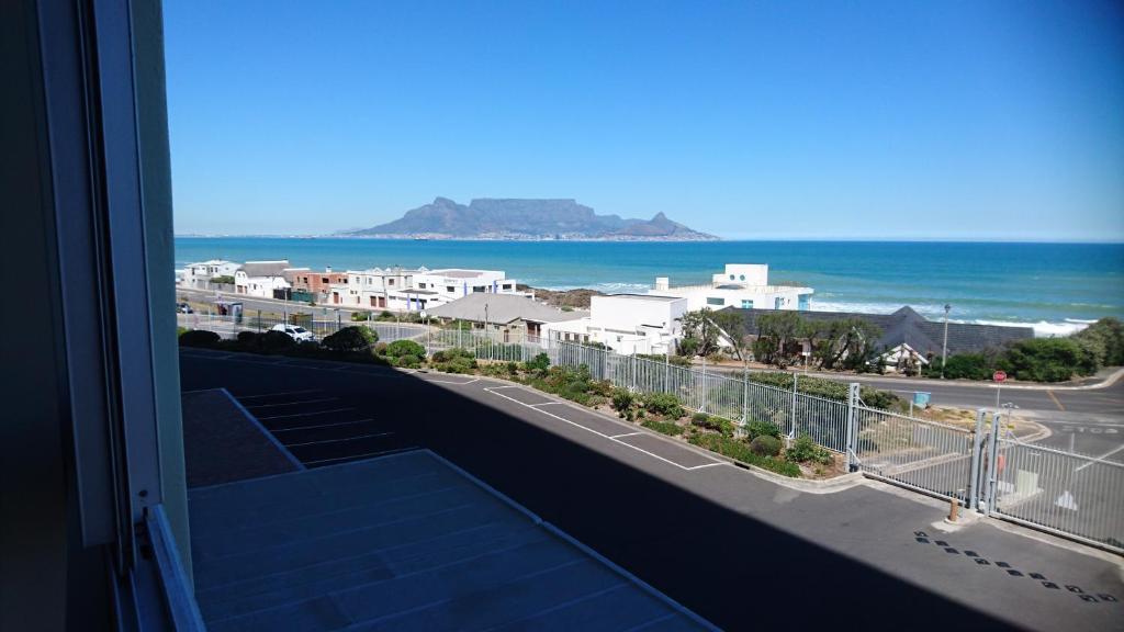 a view of the ocean from a balcony at Bloubergviews in Bloubergstrand